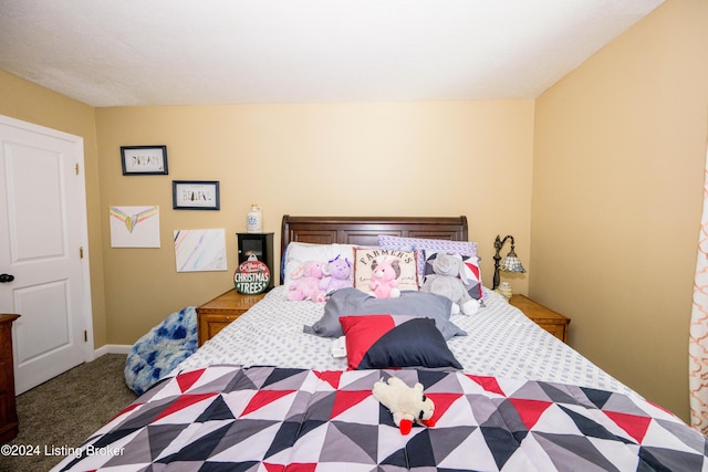 bedroom with dark carpet