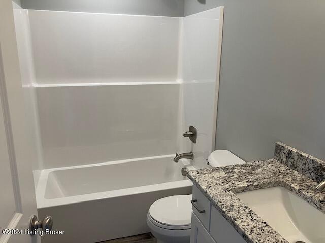 full bathroom with shower / bathing tub combination, vanity, and toilet