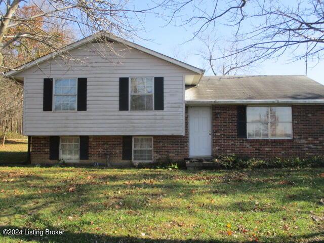 split level home with a front yard