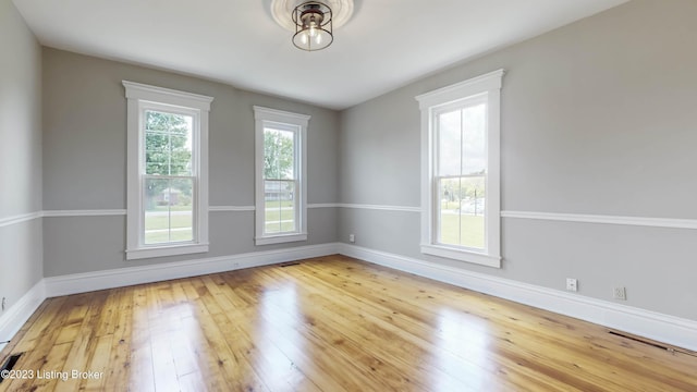 spare room featuring hardwood / wood-style flooring