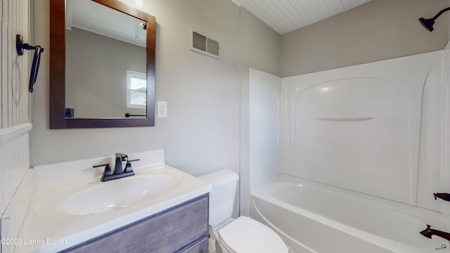 full bathroom featuring vanity, toilet, and washtub / shower combination