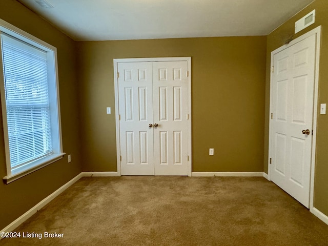 unfurnished bedroom featuring carpet flooring