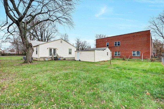 back of house with a yard