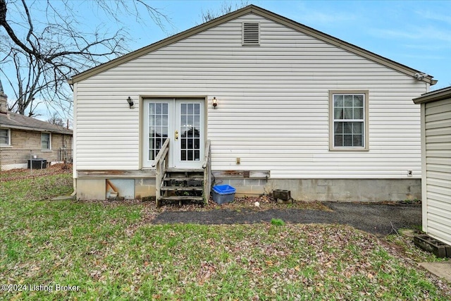 back of house featuring central AC unit and french doors