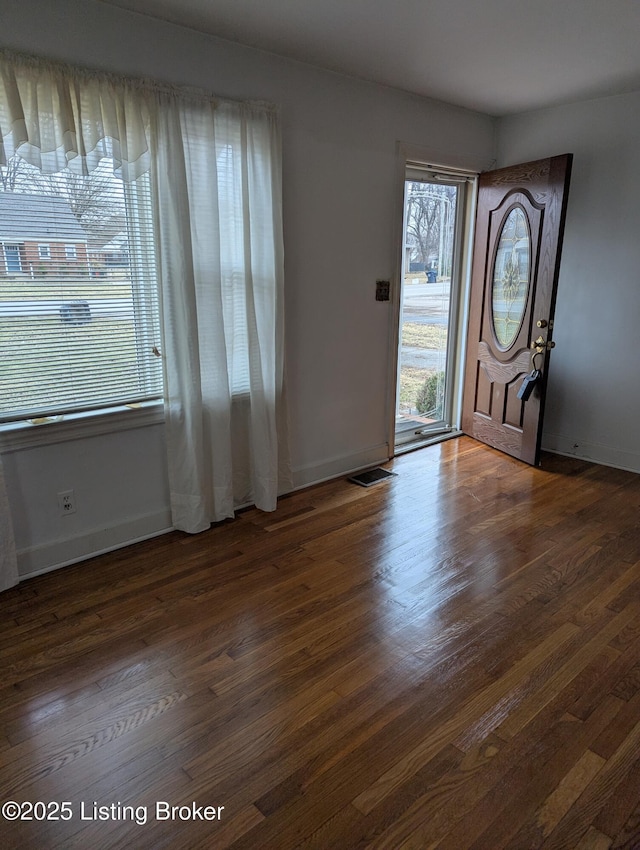 entrance foyer featuring dark hardwood / wood-style floors