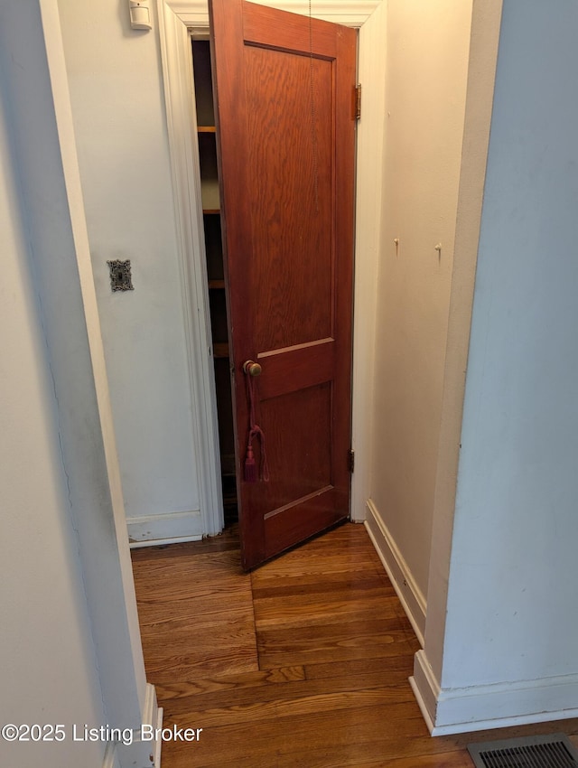 hallway featuring hardwood / wood-style floors