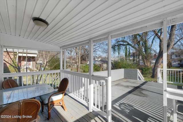 sunroom / solarium with vaulted ceiling