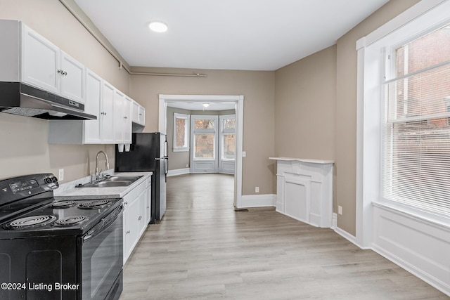 kitchen with white cabinets, sink, plenty of natural light, and black appliances