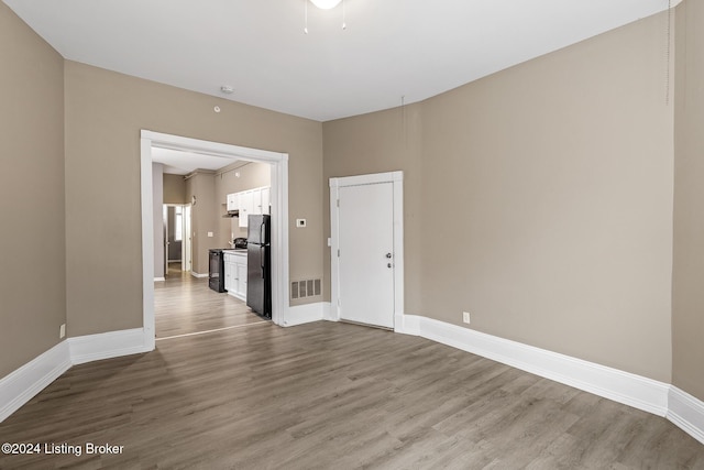 unfurnished room featuring hardwood / wood-style flooring