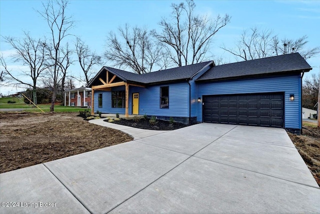 ranch-style house featuring a garage