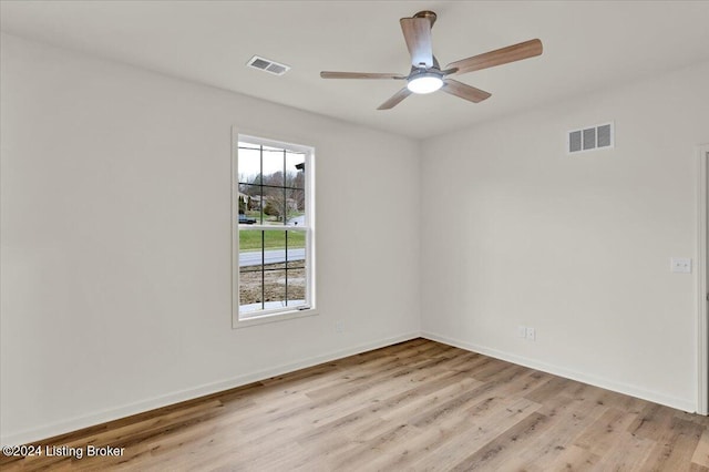 spare room with ceiling fan and light hardwood / wood-style floors