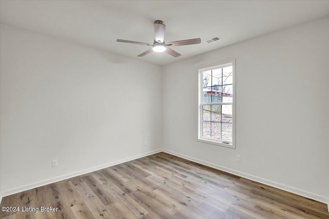 unfurnished room with light hardwood / wood-style floors