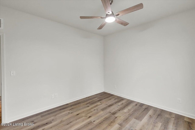 spare room with hardwood / wood-style floors