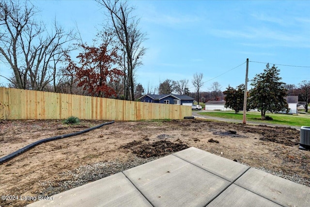 view of yard featuring central air condition unit