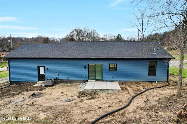 rear view of house featuring a patio and central air condition unit