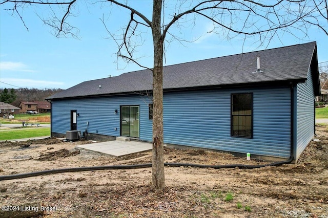 back of property featuring a patio area and central AC