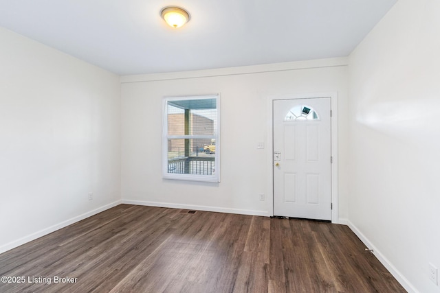 entryway with dark hardwood / wood-style floors