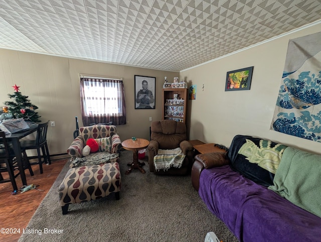 living room featuring dark hardwood / wood-style floors and ornamental molding