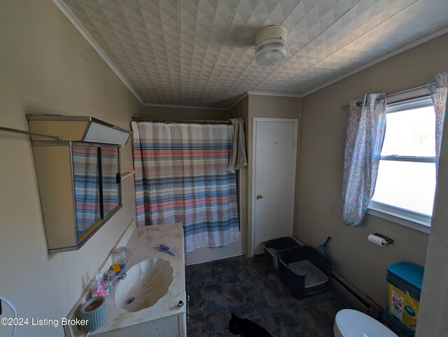 bathroom with a shower with curtain, vanity, toilet, and crown molding