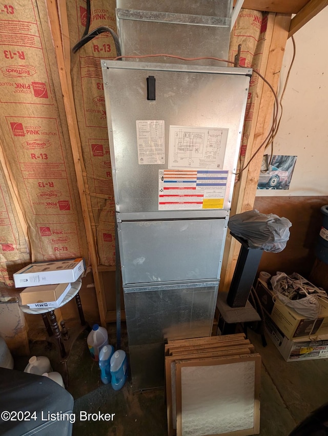 utility room with heating unit