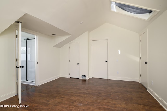 bonus room featuring dark hardwood / wood-style flooring and vaulted ceiling