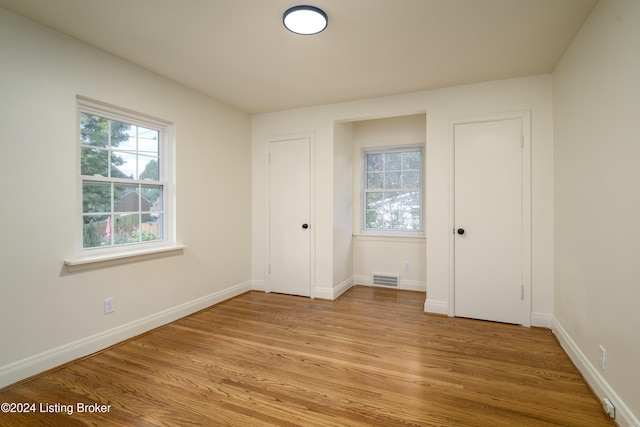 unfurnished bedroom featuring light wood-type flooring