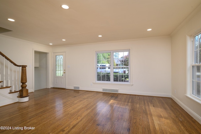 entryway featuring crown molding and hardwood / wood-style flooring