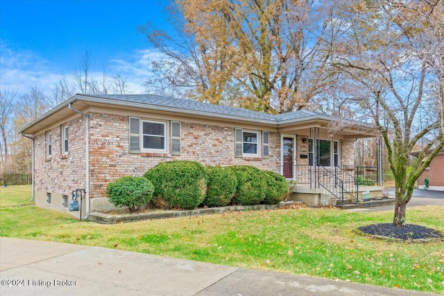 single story home with a porch and a front lawn