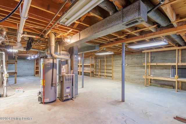 basement with heating unit and gas water heater