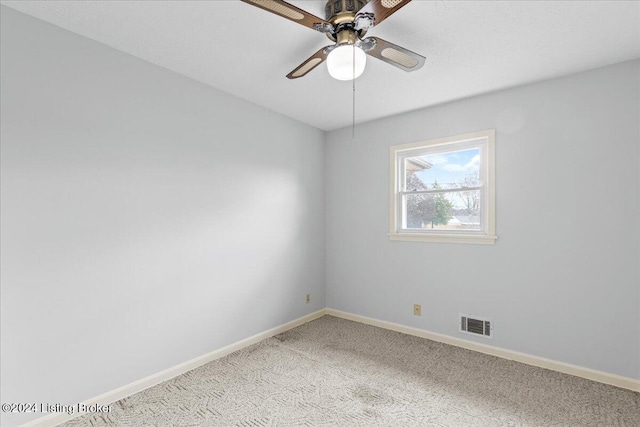 unfurnished room with ceiling fan and light colored carpet