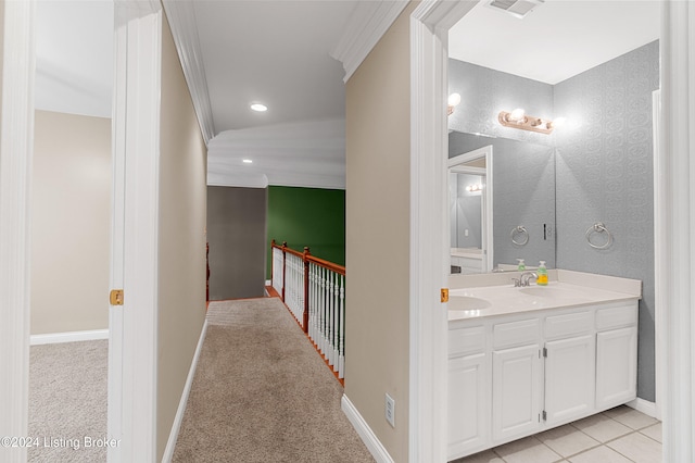 bathroom featuring vanity, tile patterned floors, and ornamental molding