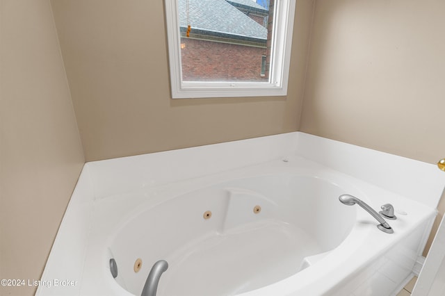 bathroom with tiled bath