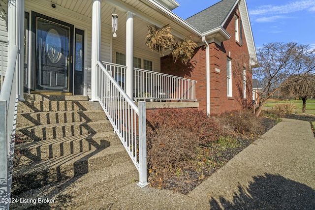 entrance to property with covered porch