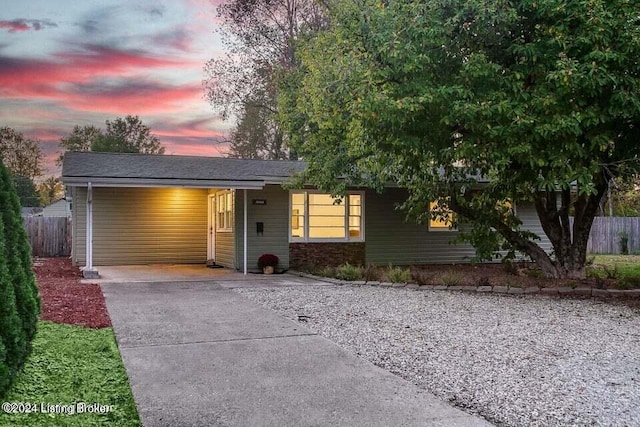 view of front of property with a carport