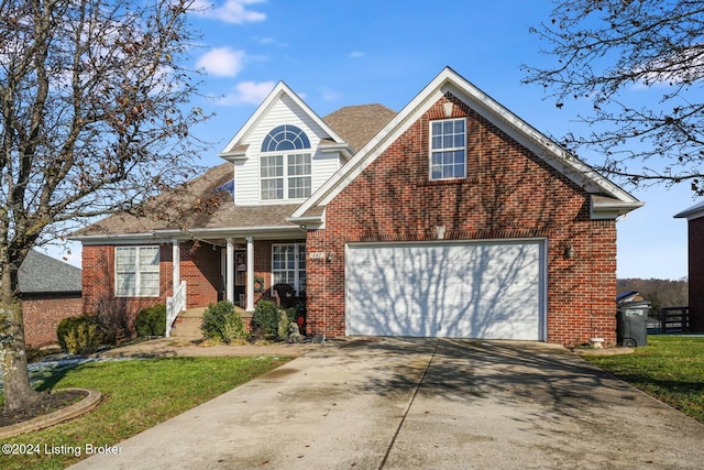 view of front property featuring a front yard and a garage