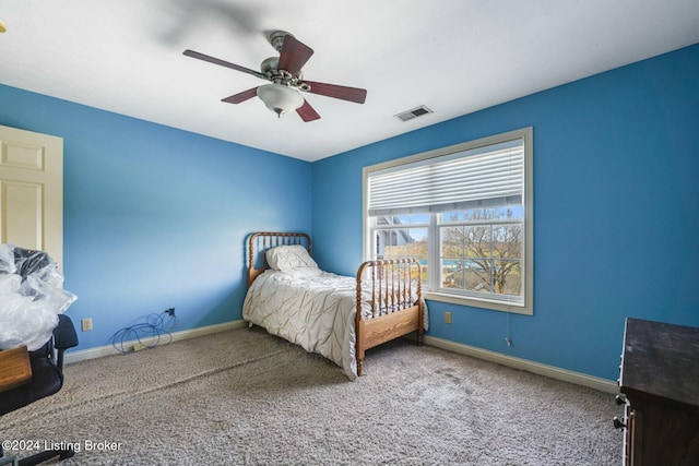 carpeted bedroom with ceiling fan