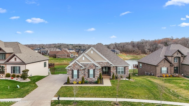 view of front of house with a water view and a front yard