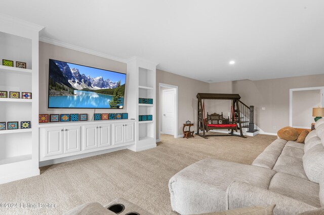 carpeted living room with crown molding and built in features