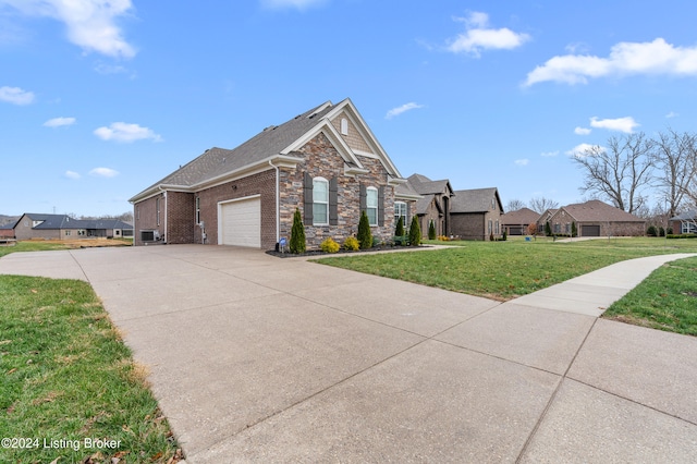 view of front facade featuring a garage and a front lawn