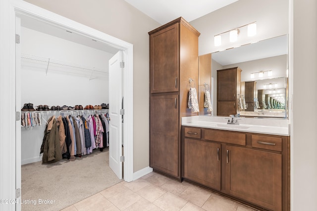 bathroom with tile patterned flooring and vanity