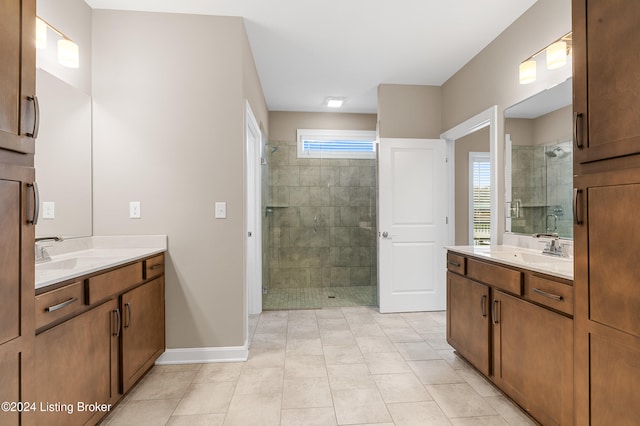 bathroom with tile patterned floors, vanity, and an enclosed shower