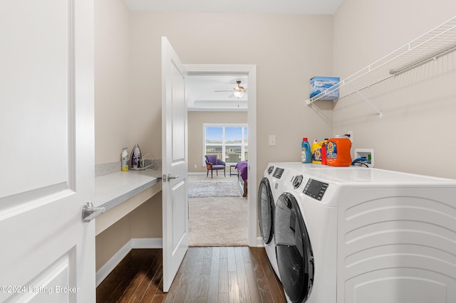 laundry room with washing machine and dryer, ceiling fan, and dark hardwood / wood-style floors