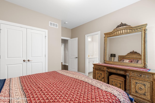 bedroom with ensuite bathroom and a closet