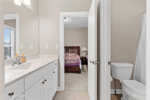 bathroom with tile patterned floors, vanity, and toilet