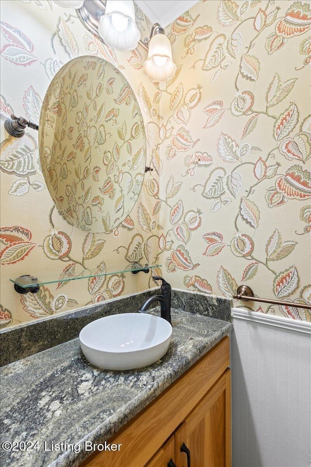 bathroom featuring vanity and crown molding