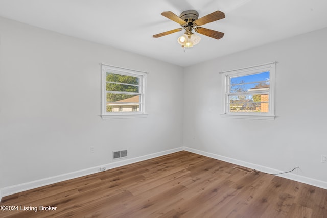 empty room with wood-type flooring and ceiling fan