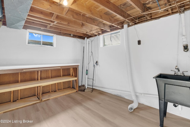 basement with hardwood / wood-style flooring and a wealth of natural light