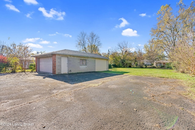 garage with a lawn