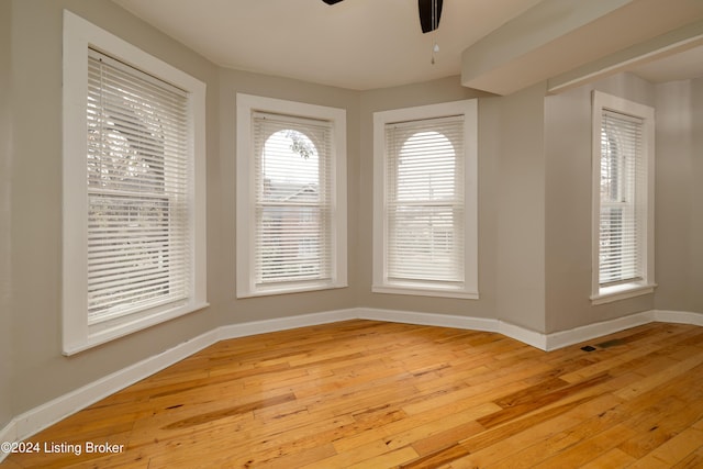 empty room featuring ceiling fan and light wood-type flooring