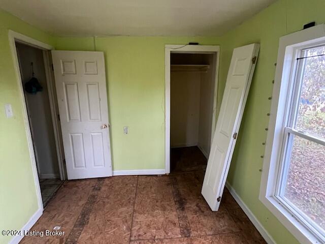 unfurnished bedroom featuring a closet